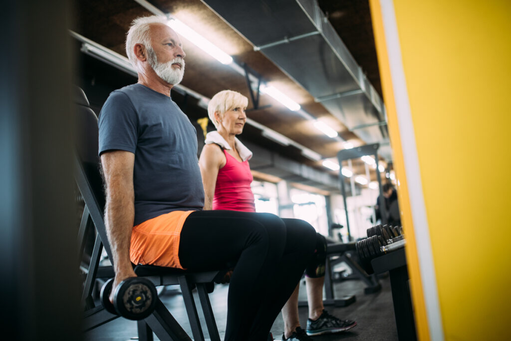 Weight training for adults in a gym with barbells