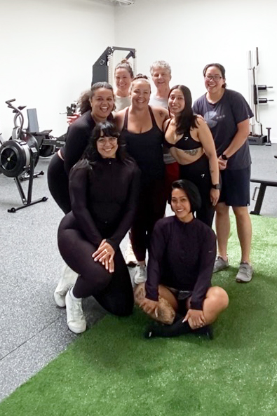 A group of adult women sharing community and strength at 3Score Gymin Berkeley